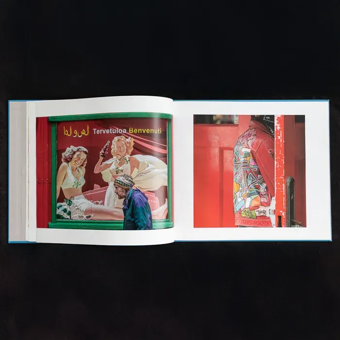 A top down shot of two pages from Kim Keller's photo book City Color featuring colorful street photography